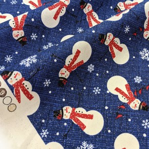 Tissu américain Thème Noël bonhomme de neige fond bleu argenté x 50cm