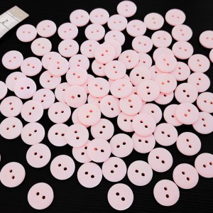 Destock 100 boutons 2 trous en résine rose clair taille 15 mm