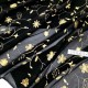 Destock 1.07m tissu tulle élastique fluide imprimé fleuri doré noir largeur 110cm