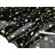 Destock 1.07m tissu tulle élastique fluide imprimé fleuri doré noir largeur 110cm