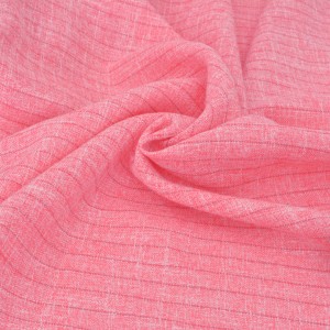 Tissu tissé teint doux fluide lourd polyester rose chiné x 50cm 