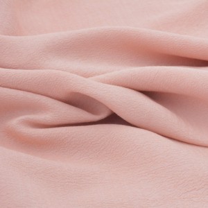 Tissu crêpe de rayonne gaufré soyeux rose pêche x 50cm 