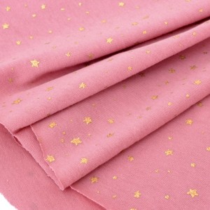 Destock 1.4m tissu jersey coton doux étoile dorée fond vieux rose rose largeur 180cm