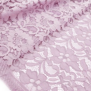 Destock 1.6m tissu dentelle de calais lycra fluide rose poudré largeur 150cm 