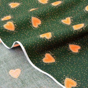 Tissu américain popeline-cœurs oranges aux pois fond vert x 50cm 