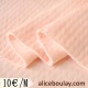 Tissu jersey matelassé tricot tubulaire rose saumon clair