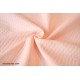 Tissu jersey matelassé tricot tubulaire rose saumon clair